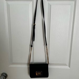 Black Michael Kors bag with strap